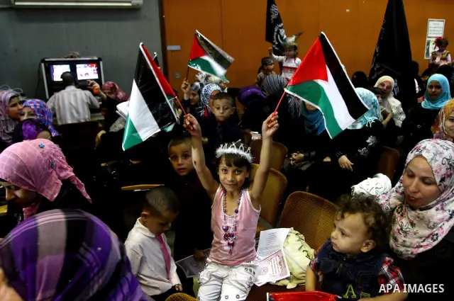 Palestinian supporters of Popular Resistance Committees take part in a rally to mark the 12th anniversary of Al-Aqsa Intifada (uprising) in Gaza city on Sept. 29,2011. Israel on Tuesday approved construction of 1,100 hom...