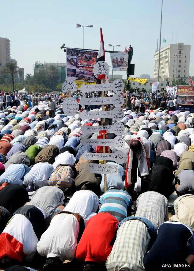 Egyptian demonstrators attend Friday prayers during a protest at Tahrir Square in Cairo, Egypt, Friday, Sept. 30, 2011. Several thousand Egyptians are protesting against the country's military ruler's decision to retain...