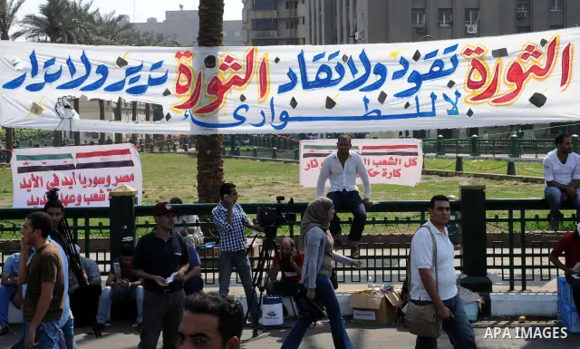 Egyptian demonstrators chant slogans during a protest at Tahrir Square in Cairo, Egypt, Friday, Sept. 30, 2011. Several thousand Egyptians are protesting against the country's military ruler's decision to retain the much...