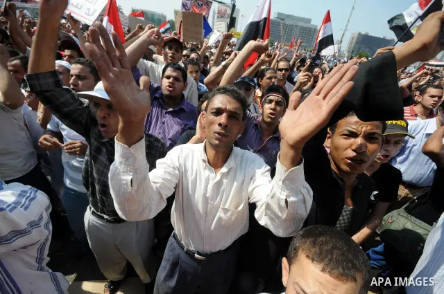 Egyptian demonstrators chant slogans during a protest at Tahrir Square in Cairo, Egypt, Friday, Sept. 30, 2011. Several thousand Egyptians are protesting against the country's military ruler's decision to retain the much...