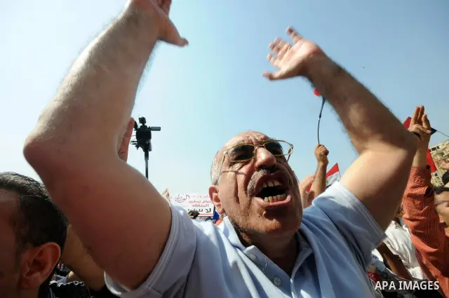 Egyptian demonstrators chant slogans during a protest at Tahrir Square in Cairo, Egypt, Friday, Sept. 30, 2011. Several thousand Egyptians are protesting against the country's military ruler's decision to retain the much...
