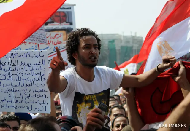 Egyptian demonstrators chant slogans during a protest at Tahrir Square in Cairo, Egypt, Friday, Sept. 30, 2011. Several thousand Egyptians are protesting against the country's military ruler's decision to retain the much...