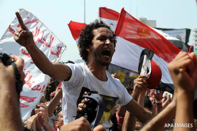 Egyptian demonstrators chant slogans during a protest at Tahrir Square in Cairo, Egypt, Friday, Sept. 30, 2011. Several thousand Egyptians are protesting against the country's military ruler's decision to retain the much...