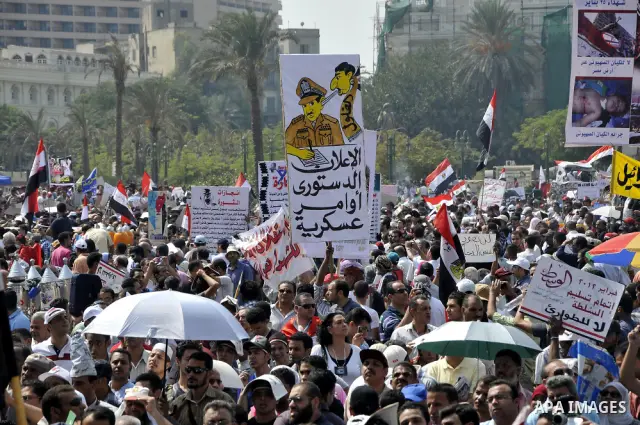 Egyptian demonstrators chant slogans during a protest at Tahrir Square in Cairo, Egypt, Friday, Sept. 30, 2011. Several thousand Egyptians are protesting against the country's military ruler's decision to retain the much...