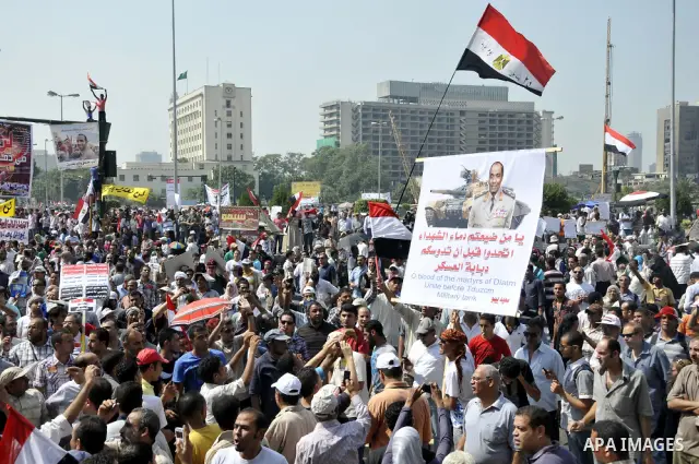 Egyptian demonstrators chant slogans during a protest at Tahrir Square in Cairo, Egypt, Friday, Sept. 30, 2011. Several thousand Egyptians are protesting against the country's military ruler's decision to retain the much...