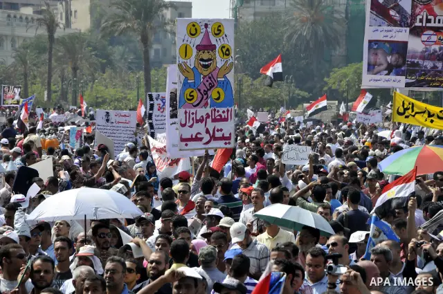 Egyptian demonstrators chant slogans during a protest at Tahrir Square in Cairo, Egypt, Friday, Sept. 30, 2011. Several thousand Egyptians are protesting against the country's military ruler's decision to retain the much...