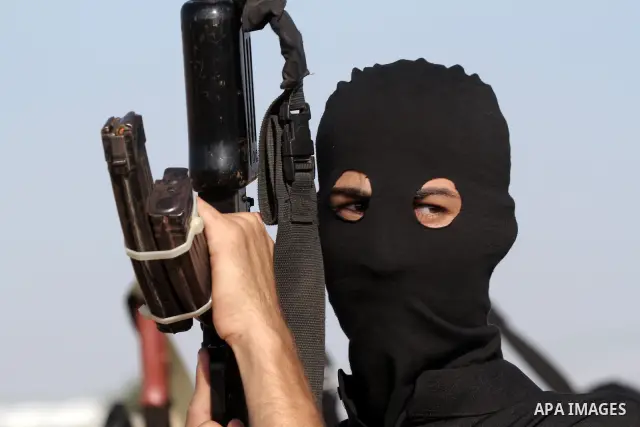 Palestinian militants from the Popular Resistance Movement participate in a training session in the southern Gaza Strip town of Khan Younis on Sept.30,2011. Israel on Tuesday approved construction of 1,100 homes for Jews...