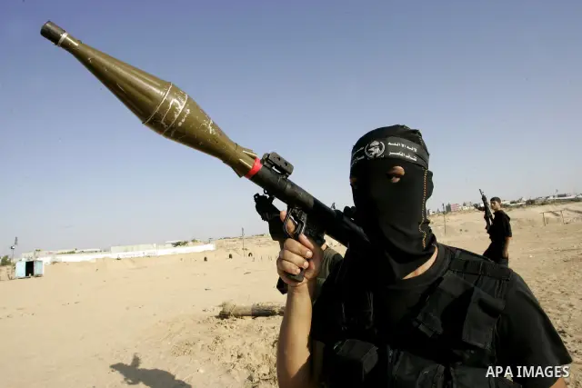 Palestinian militants from the Popular Resistance Movement participate in a training session in the southern Gaza Strip town of Khan Younis on Sept.30,2011. Israel on Tuesday approved construction of 1,100 homes for Jews...