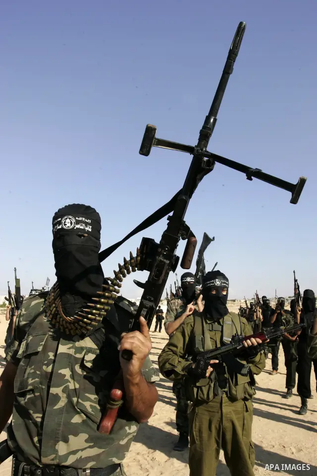 Palestinian militants from the Popular Resistance Movement participate in a training session in the southern Gaza Strip town of Khan Younis on Sept.30,2011. Israel on Tuesday approved construction of 1,100 homes for Jews...