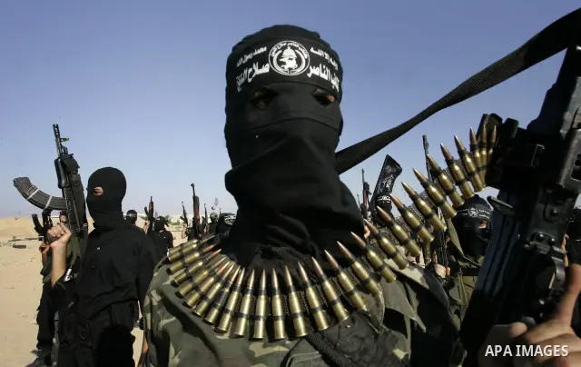 Palestinian militants from the Popular Resistance Movement participate in a training session in the southern Gaza Strip town of Khan Younis on Sept.30,2011. Israel on Tuesday approved construction of 1,100 homes for Jews...