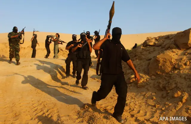 Palestinian militants from the Popular Resistance Movement participate in a training session in the southern Gaza Strip town of Khan Younis on Sept.30,2011. Israel on Tuesday approved construction of 1,100 homes for Jews...