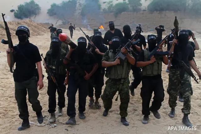 Palestinian militants from the Popular Resistance Movement participate in a training session in the southern Gaza Strip town of Khan Younis on Sept.30,2011. Israel on Tuesday approved construction of 1,100 homes for Jews...