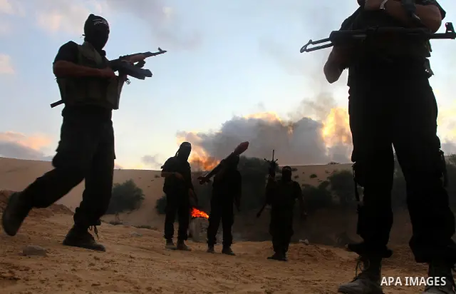 Palestinian militants from the Popular Resistance Movement participate in a training session in the southern Gaza Strip town of Khan Younis on Sept.30,2011. Israel on Tuesday approved construction of 1,100 homes for Jews...