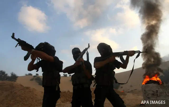 Palestinian militants from the Popular Resistance Movement participate in a training session in the southern Gaza Strip town of Khan Younis on Sept.30,2011. Israel on Tuesday approved construction of 1,100 homes for Jews...