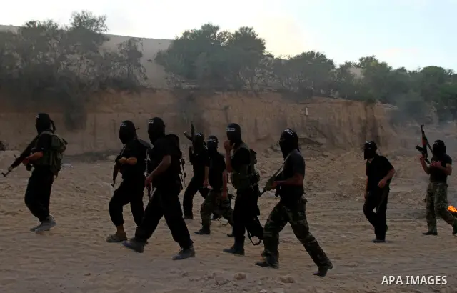 Palestinian militants from the Popular Resistance Movement participate in a training session in the southern Gaza Strip town of Khan Younis on Sept.30,2011. Israel on Tuesday approved construction of 1,100 homes for Jews...