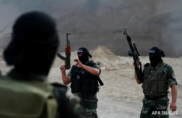Palestinian militants from the Popular Resistance Movement participate in a training session in the southern Gaza Strip town of Khan Younis on Sept.30,2011. Israel on Tuesday approved construction of 1,100 homes for Jews...