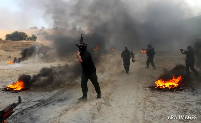 Palestinian militants from the Popular Resistance Movement participate in a training session in the southern Gaza Strip town of Khan Younis on Sept.30,2011. Israel on Tuesday approved construction of 1,100 homes for Jews...