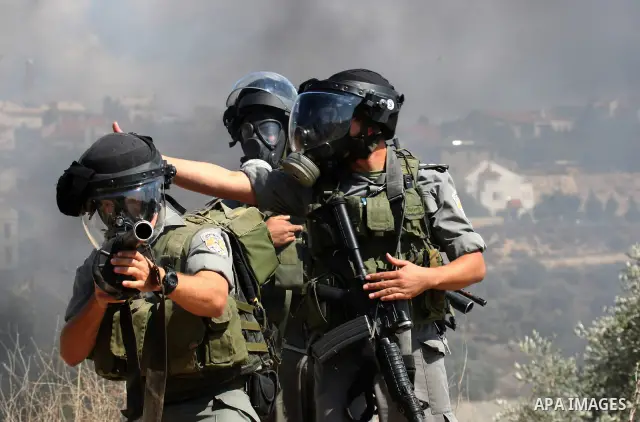 Israeli soldiers clash with Palestinian stone throwers on September 30, 2011 in the West Bank village of Kfar Kadum. Photo by Wagdi Eshtayah