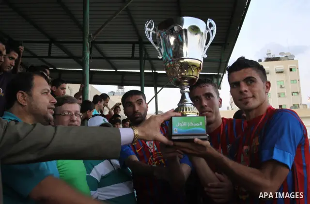Spanish team Barcelona celebrates the victory over arch-rivals Real Madrid on penalties after the end of the game, where held on the stadium Palestine in Gaza city on Friday, on Sep. 30, 2011. The Ministry of Youth and S...
