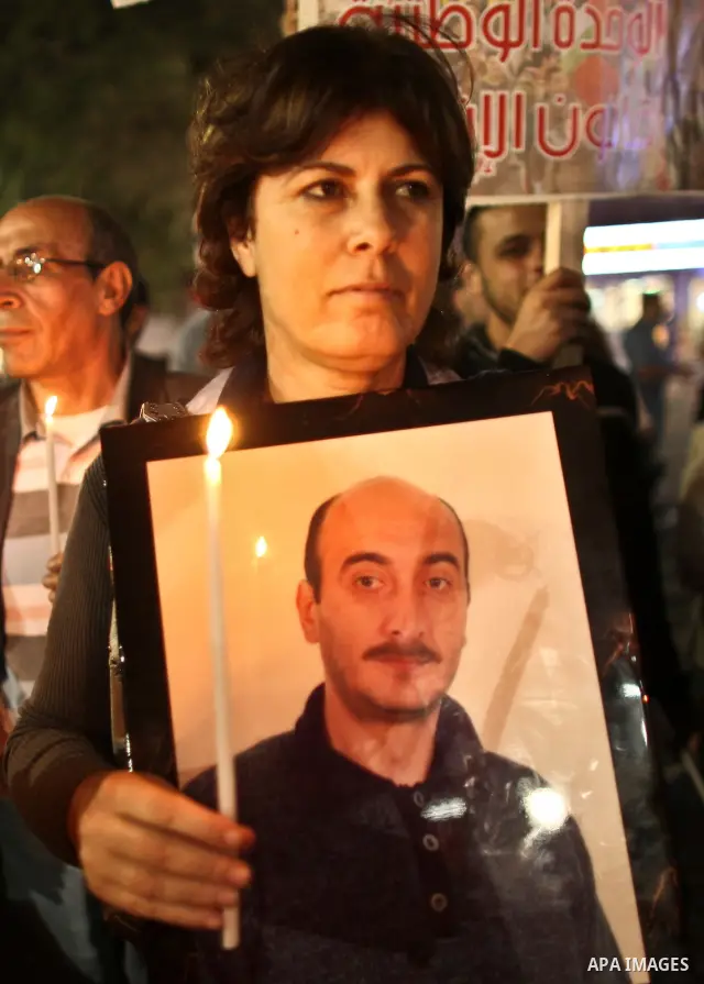 Hundreds of families of Palestinian prisoners held in Israeli jails protest in downtown Ramallah in the West Bank on October 1, 2011 in support of prisoners on hunger strike for a third day. Photo by Issam Rimawi
