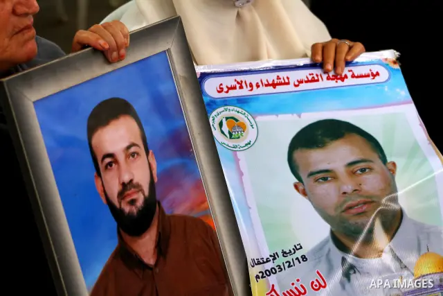 Families of Palestinian prisoners held in Israeli jails protest outside the International Committee of the Red Cross (ICRC) offices in Gaza City on October 2, 2011 in support of prisoners on hunger strike. Photo by Ashra...