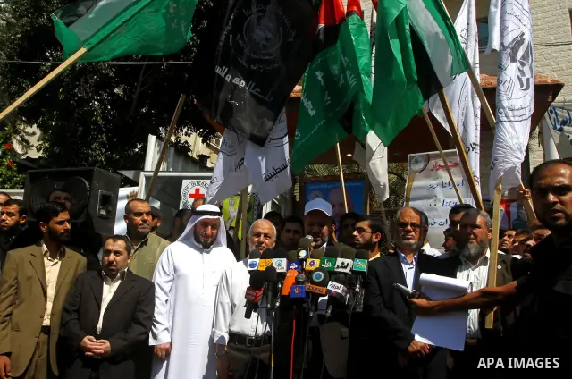 Palestinians deliver speech in a protest at the Red Cross headquarters in Gaza City on October 3, 2011, to show their solidarity with Palestinian prisoners held in Israeli jails. On Wednesday, Palestinian prisoners in Is...