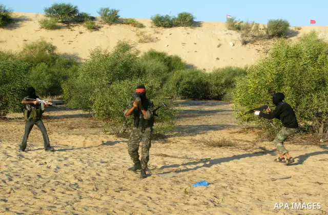Palestinian militants with the Democratic Front for the Liberation of Palestine (DFLP) take part in a training session in the southern Gaza Strip town of Khan Yunis on October 03, 2011. Photo by Abed Rahim Khatib