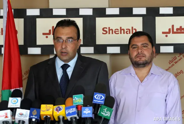 Memeber of th Palestinian Ministry of Culture delivers speech in a press conference talking about the international book exhibition, will be inaugurated tomorrow, Wensday, despite the obstacles, in Gaza city on Oct. 4, 2...