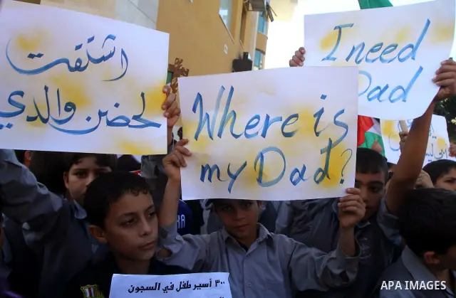 Palestinian students take part in a protest demanding for release of Palestinian prisoners in Israeli jails, at the Red Cross head headquarters in Gaza City on Oct. 4, 2011. Palestinians continue their protests in the We...