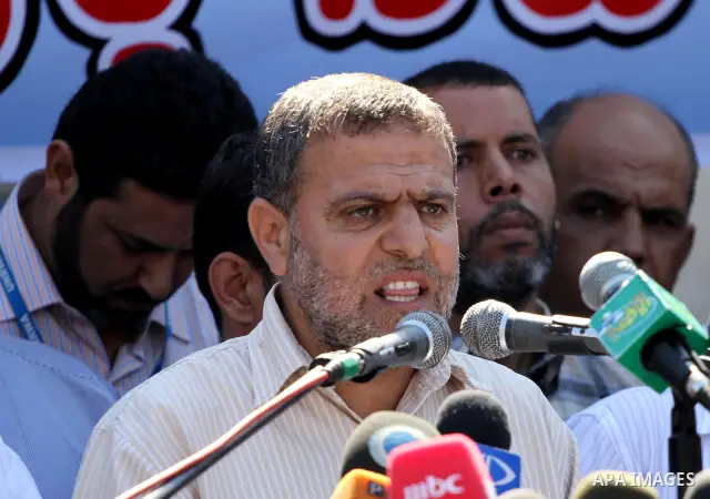 Palestinians take part in a protest against the decision to stop the head of the Federation of staff, Suhail al-Hindi to work temporarily, in front of the UNRWA headquarters in Gaza City on Oct. 5,2011. Union officials c...