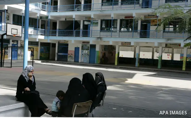Palestinian teachers sit in an empty school because of a strike of teachers at a school in Rafah, southern Gaza Strip on October 5, 2011. Union officials called the United Nations Relief and Works Agency (UNRWA) employee...