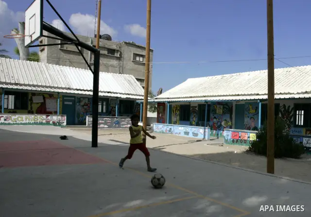 A Palestinian child plays in an empty school because of a strike of teachers at a school in Rafah, southern Gaza Strip on October 5, 2011. Union officials called the United Nations Relief and Works Agency (UNRWA) employe...