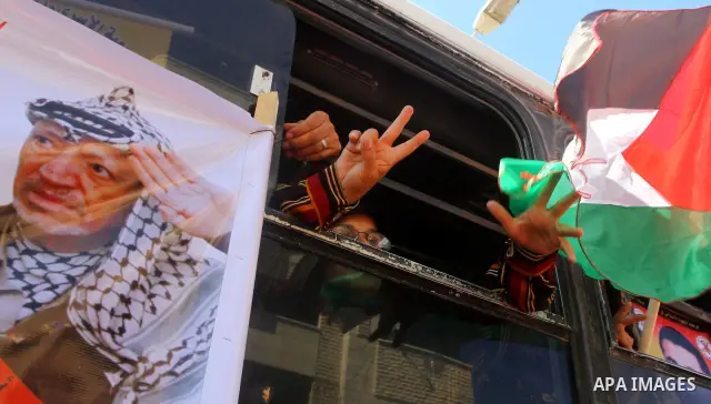Palestinians take part in a protest near the Erez border crossing between Israel and northern Gaza Strip October 5, 2011, to show their solidarity with Palestinian prisoners held in Israeli jails. Hundreds of Palestinian...