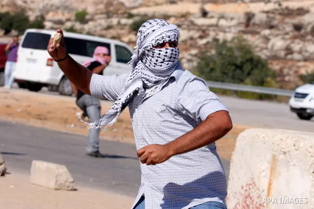 Palestinian protestors clash with Israeli forces during a demonstration calling for the release of prisoners held in Israeli jails and in support of inmates in hunger strike, on October 5, 2011 near Israel's Ofer prison,...