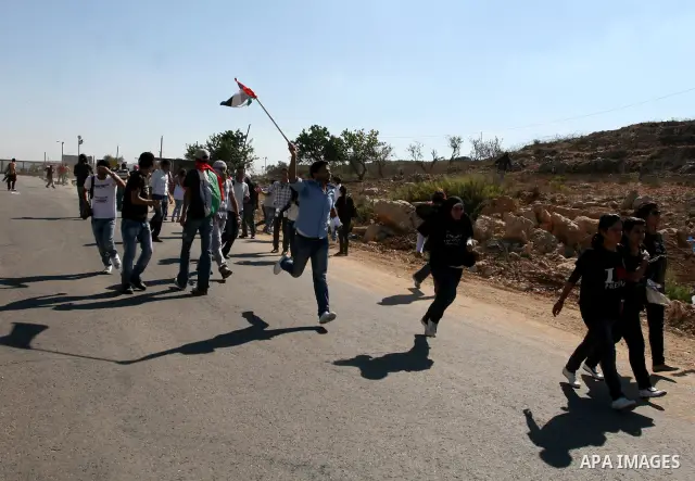 Palestinian protestors clash with Israeli forces during a demonstration calling for the release of prisoners held in Israeli jails and in support of inmates in hunger strike, on October 5, 2011 near Israel's Ofer prison,...