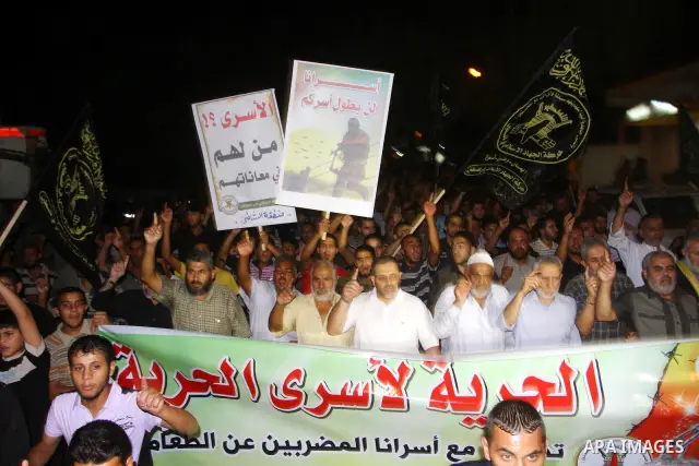 Palestinian Jihad Islamic supporters take part in a protest in Gaza city October 5, 2011, to show their solidarity with Palestinian prisoners held in Israeli jails. Hundreds of Palestinians in Israeli jails have joined a...