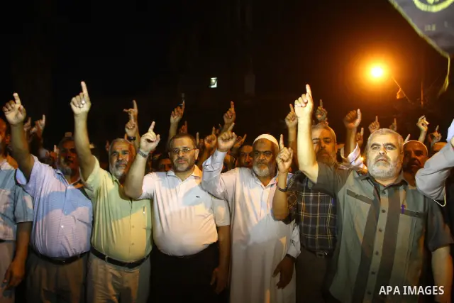 Palestinian Jihad Islamic supporters take part in a protest in Gaza city October 5, 2011, to show their solidarity with Palestinian prisoners held in Israeli jails. Hundreds of Palestinians in Israeli jails have joined a...
