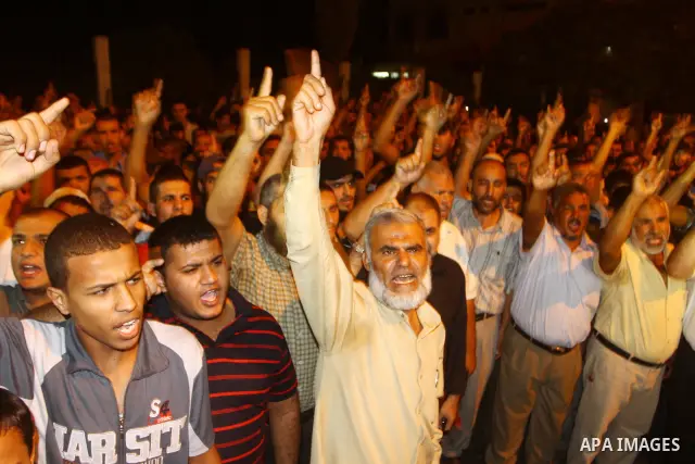 Palestinian Jihad Islamic supporters take part in a protest in Gaza city October 5, 2011, to show their solidarity with Palestinian prisoners held in Israeli jails. Hundreds of Palestinians in Israeli jails have joined a...