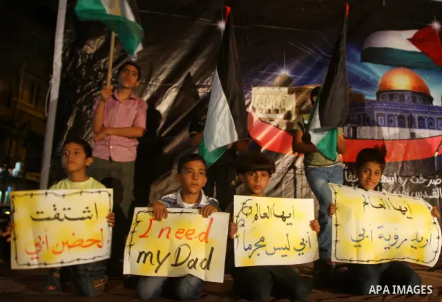 Palestinian Hamas supporters take part in a protest in Gaza city October 5, 2011, to show their solidarity with Palestinian prisoners held in Israeli jails. Hundreds of Palestinians in Israeli jails have joined a hunger...
