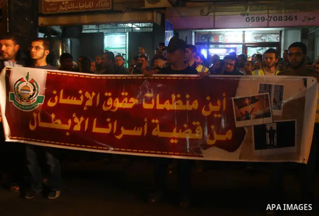 Palestinian Hamas supporters take part in a protest in Gaza city October 5, 2011, to show their solidarity with Palestinian prisoners held in Israeli jails. Hundreds of Palestinians in Israeli jails have joined a hunger...