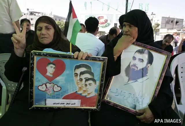 Palestinians take part in a protest in a solidarity tent with prisoners jailed in Israeli in Rafah, southern Gaza Strip on Oct, 6, 2011, to show their solidarity with Palestinian prisoners held in Israeli jails. Hundreds...