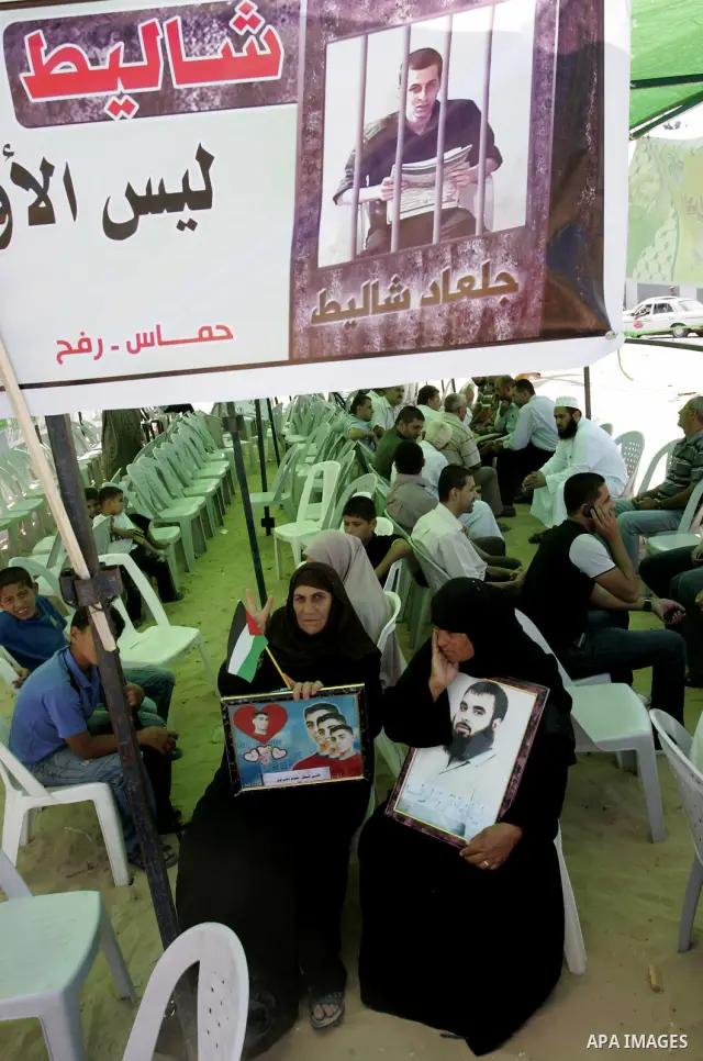 Palestinians take part in a protest in a solidarity tent with prisoners jailed in Israeli in Rafah, southern Gaza Strip on Oct, 6, 2011, to show their solidarity with Palestinian prisoners held in Israeli jails. Hundreds...