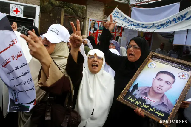 Palestinian women take part in a protest in Gaza City Oct, 06, 2011, to show solidarity with Palestinian prisoners held in Israeli jails. Hundreds of Palestinians in Israeli jails have joined a hunger strike to protest a...