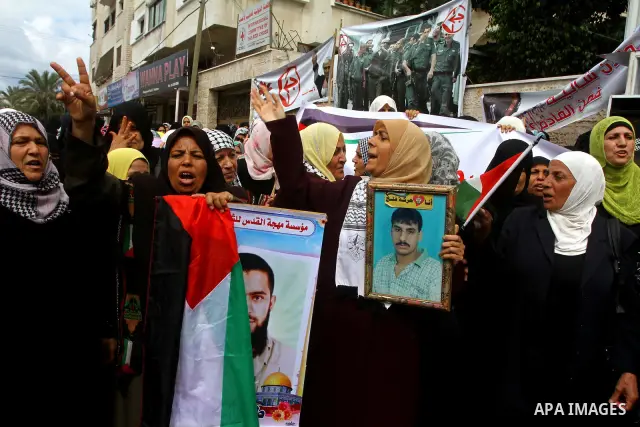 Palestinian women take part in a protest in Gaza City Oct, 06, 2011, to show solidarity with Palestinian prisoners held in Israeli jails. Hundreds of Palestinians in Israeli jails have joined a hunger strike to protest a...