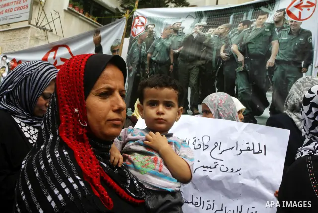 Palestinian women take part in a protest in Gaza City Oct, 06, 2011, to show solidarity with Palestinian prisoners held in Israeli jails. Hundreds of Palestinians in Israeli jails have joined a hunger strike to protest a...