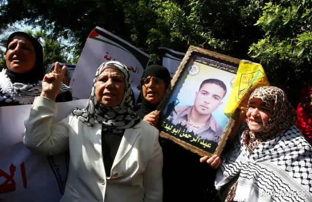 Palestinian women take part in a protest in Gaza City Oct, 06, 2011, to show solidarity with Palestinian prisoners held in Israeli jails. Hundreds of Palestinians in Israeli jails have joined a hunger strike to protest a...