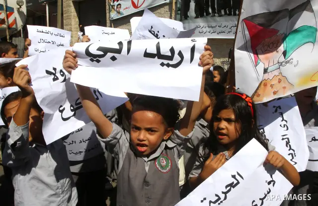 Palestinian women take part in a protest in Gaza City Oct, 06, 2011, to show solidarity with Palestinian prisoners held in Israeli jails. Hundreds of Palestinians in Israeli jails have joined a hunger strike to protest a...