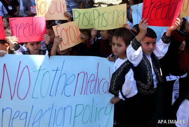 Palestinian women take part in a protest in Gaza City Oct, 06, 2011, to show solidarity with Palestinian prisoners held in Israeli jails. Hundreds of Palestinians in Israeli jails have joined a hunger strike to protest a...