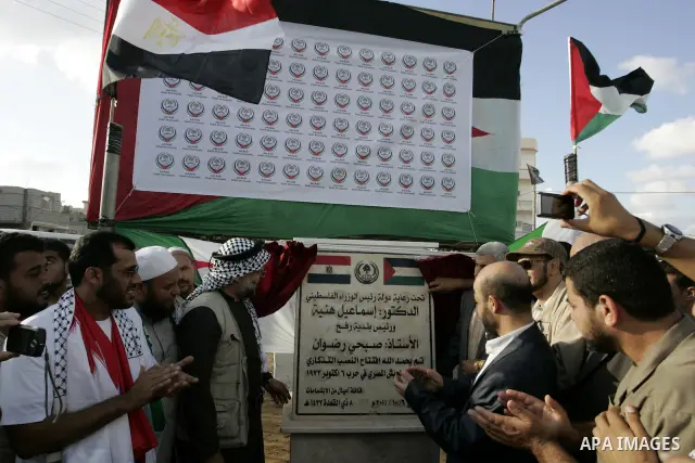 Palestinians and the members of ''Miles of Smiles 6" aid convoy take part in the opening ceremony of the memorial for Egyptians who killed during the 6 Arab-Israeli war in 1973 in Rafah, southern Gaza Strip on Oct. 6,201...