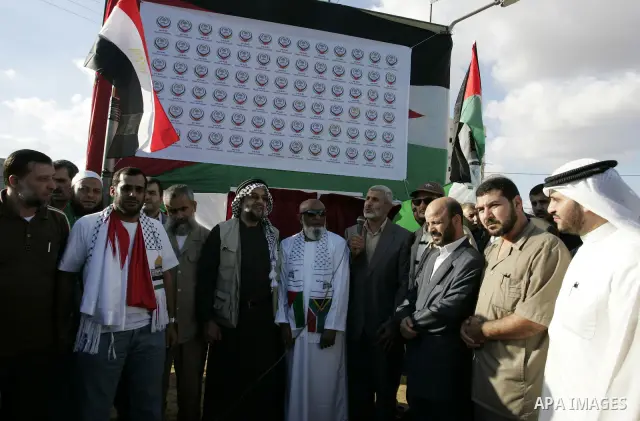 Palestinians and the members of ''Miles of Smiles 6" aid convoy take part in the opening ceremony of the memorial for Egyptians who killed during the 6 Arab-Israeli war in 1973 in Rafah, southern Gaza Strip on Oct. 6,201...